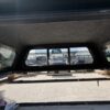 Premium LEER 100XR truck cap for Toyota Tacoma with secure weather-resistant cargo protection.