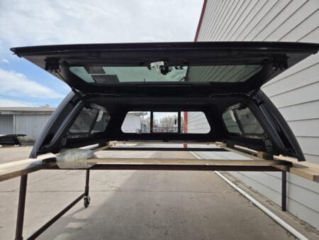 Premium LEER 100XR truck cap for Toyota Tacoma with secure weather-resistant cargo protection.