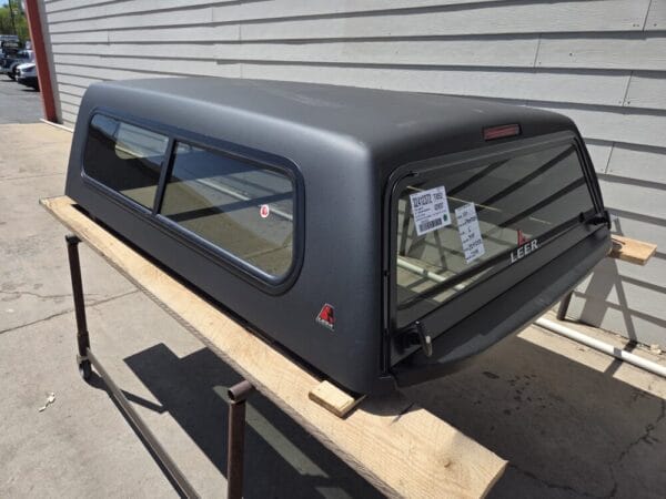 Premium LEER 100S truck cap for Nissan Frontier with secure weather-resistant storage and sleek styling. Premium LEER 100S truck cap for Nissan Frontier with secure weather-resistant storage and sleek styling.