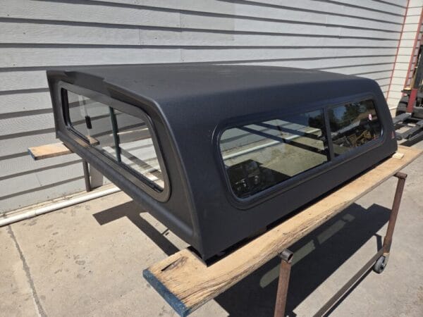 Premium LEER 100S truck cap for Nissan Frontier with secure weather-resistant storage and sleek styling.-600x450 Premium LEER 100S truck cap for Nissan Frontier with secure weather-resistant storage and sleek styling.