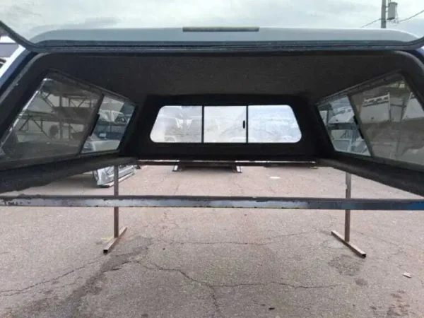 The A.R.E. V-Series topper for Nissan Titan delivers premium frameless styling, secure truck bed storage, and dependable weather-resistant protection for work, travel, camping, and daily driving. The A.R.E. V-Series topper for Nissan Titan delivers premium frameless styling, secure truck bed storage, and dependable weather-resistant protection for work, travel, camping, and daily driving.