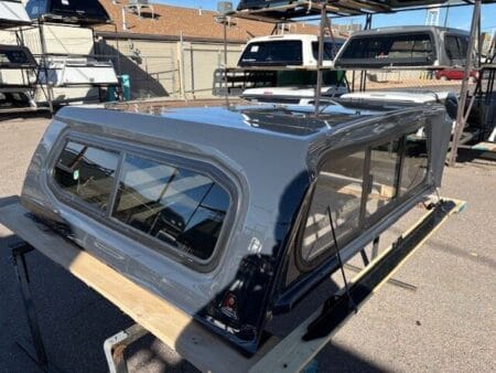 Premium LEER 100XR truck cap for Toyota Tacoma with secure weather-resistant cargo protection.