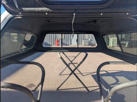 Premium A.R.E. MX Series topper for Ford F150 with secure weather-resistant cargo protection.
