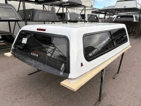 Premium LEER Mile High Deluxe topper for Ram 2500 with elevated cargo protection and secure storage. Premium LEER Mile High Deluxe topper for Ram 2500 with elevated cargo protection and secure storage.