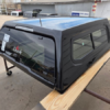 Premium LEER 100XR truck cap for Toyota Tacoma with secure weather-resistant cargo protection.