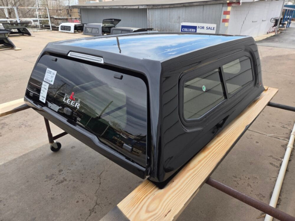 Premium LEER 100XR truck cap for Toyota Tacoma with secure weather-resistant cargo protection.