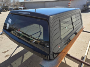 Premium LEER 100XR truck cap for Ford F150 with secure weather-resistant cargo protection.