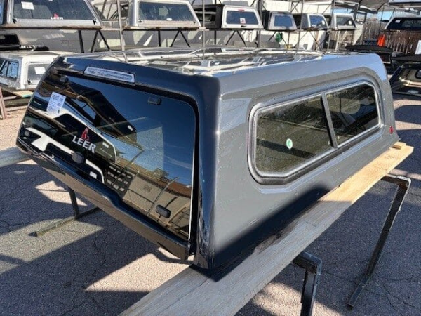 Premium LEER 100XR truck cap for Toyota Tacoma with secure weather-resistant cargo protection.