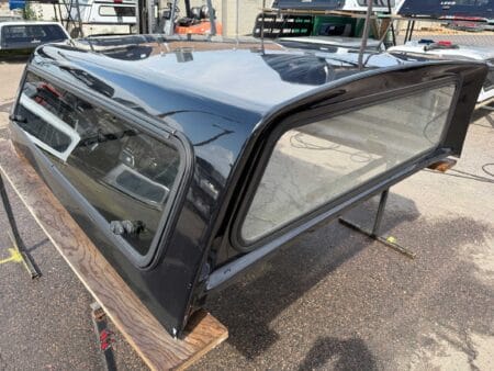 The A.R.E. V Series topper for Ford F150 delivers secure truck bed storage, premium fiberglass durability, and dependable weather-resistant protection with modern aerodynamic styling.