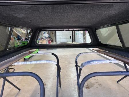 The A.R.E. DCU topper for Ford F350 delivers commercial-grade security, organized equipment storage, and dependable weather-resistant protection for contractors, fleets, and service professionals.