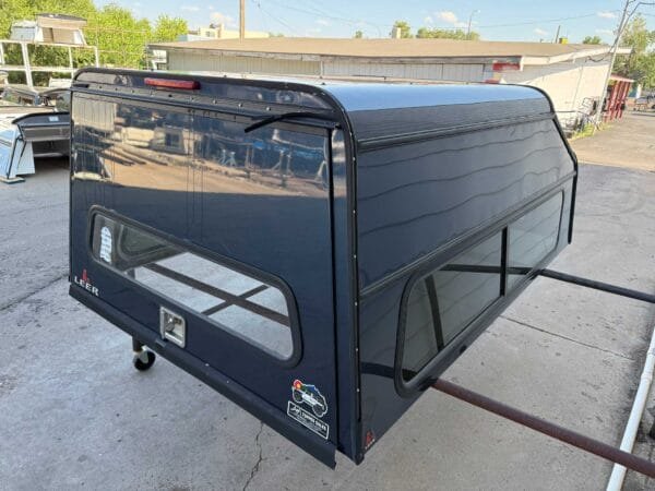 The LEER DCC topper for Jeep Comanche delivers commercial-grade aluminum durability, secure tool storage, and dependable weather-resistant protection for work and utility applications.