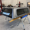 The A.R.E. V Series topper for GMC Sierra 1500 provides secure truck bed storage, premium fiberglass durability, and aerodynamic styling for work, travel, and everyday use. The A.R.E. V Series topper for GMC Sierra 1500 provides secure truck bed storage, premium fiberglass durability, and aerodynamic styling for work, travel, and everyday use.